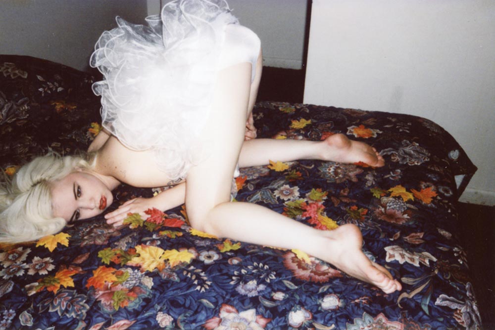 Girl on a bed. Photograph by Limir Smath.
