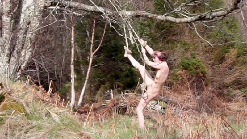 A nude girl stuck and tied to a tree films herself and becomes a piece of video art. Hilde Krohne Huse on youtube.